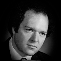 A headshot of Michael James Breaugh