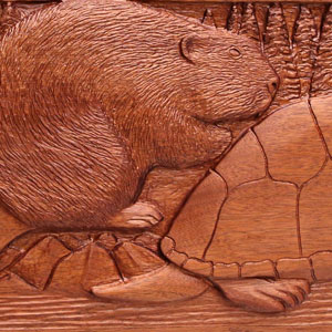 Carving detail featuring a beaver.