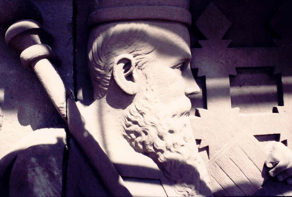 Close-up of a figure on the frieze located above the south entrance of the Legislative Building.