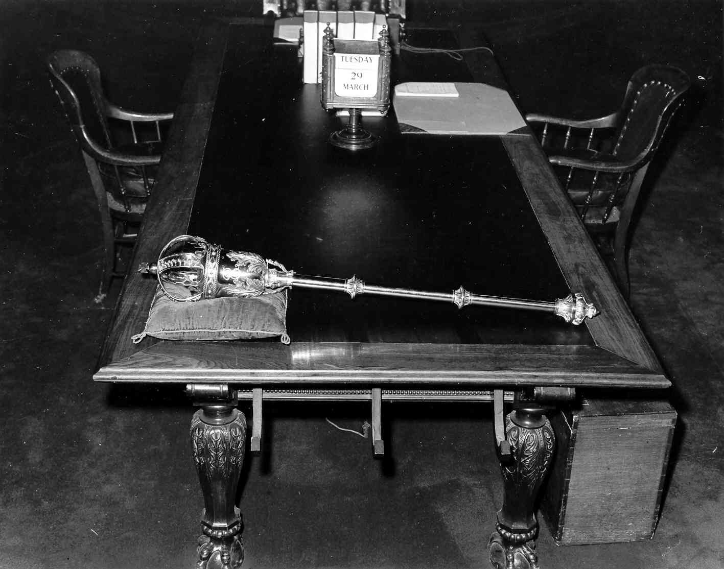 The Legislative Mace laying on the Clerk’s Table in the Chamber, circa 1960.