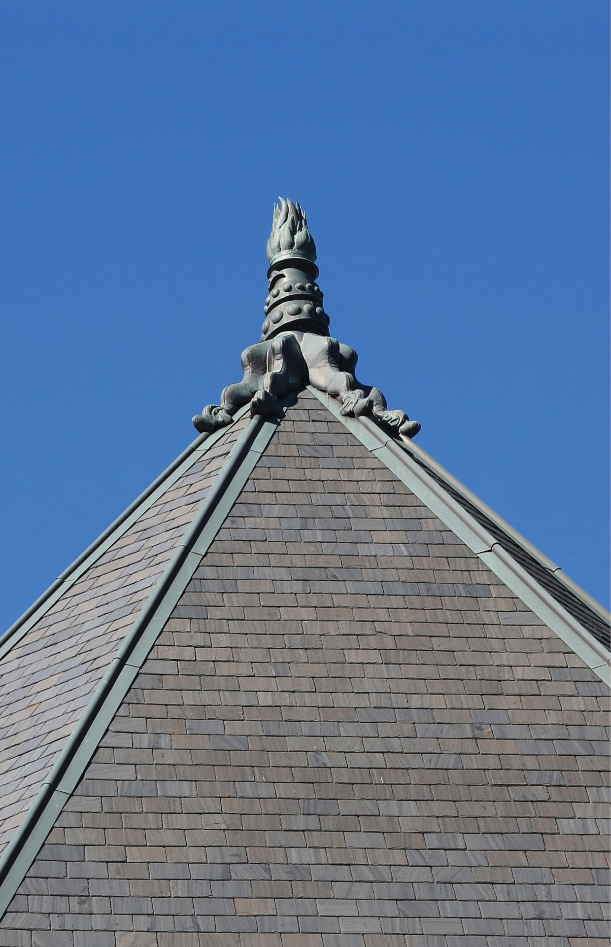 Close-up of a copper finial on the slate roof of the Legislative building.