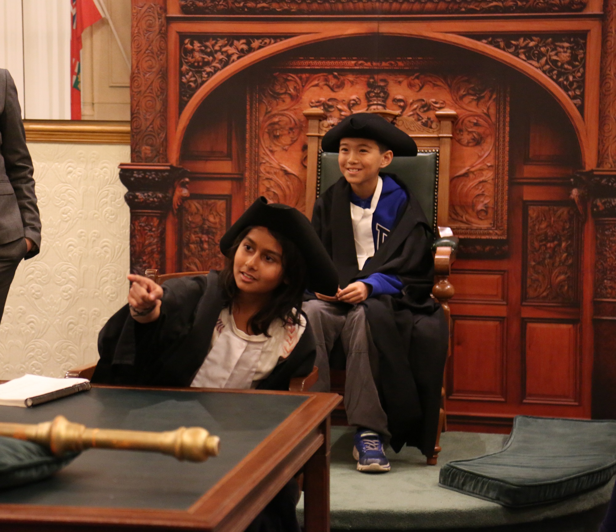 A picture of students taking part in a mock parliamentary debate at Ontario's Legislative Building.