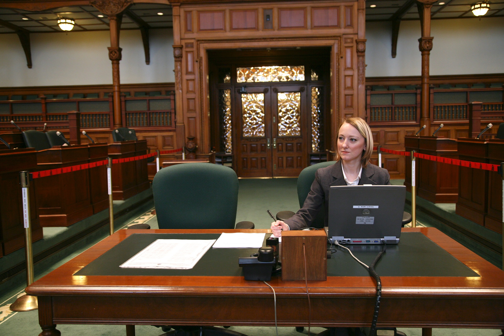 A picture of a Hansard Reporter in the Legislative Chamber.