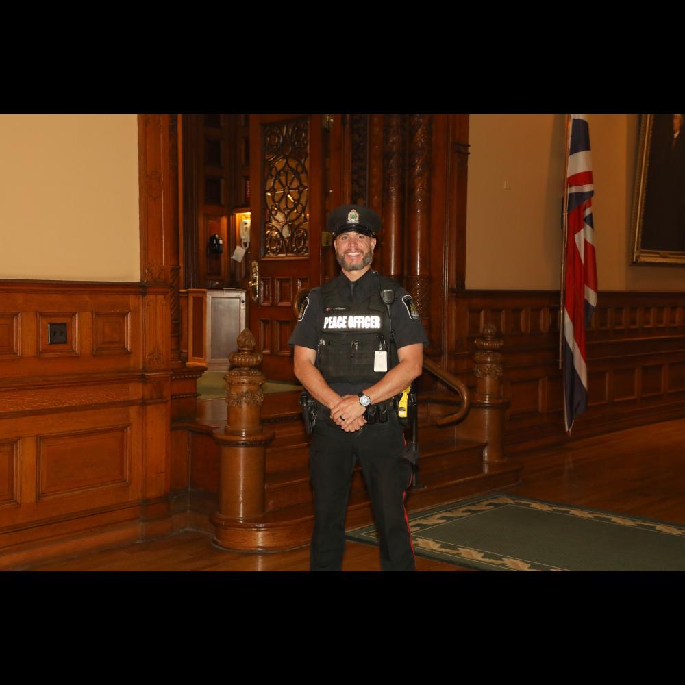 Peace Officer in front of the legislative Chamber