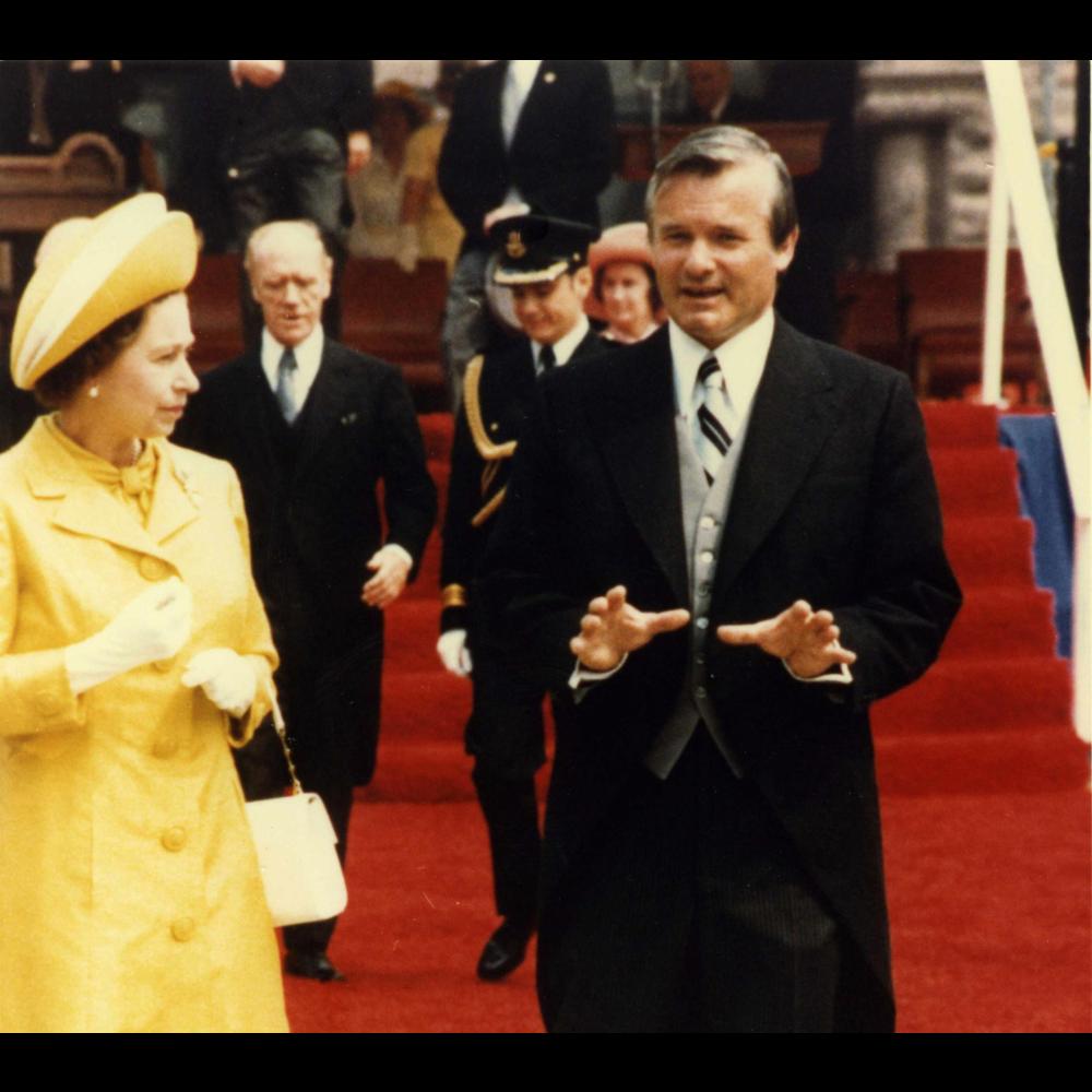 Her Majesty Queen Elizabeth II with Ontario Premier Bill Davis in front of Ontario's Legislative Building.