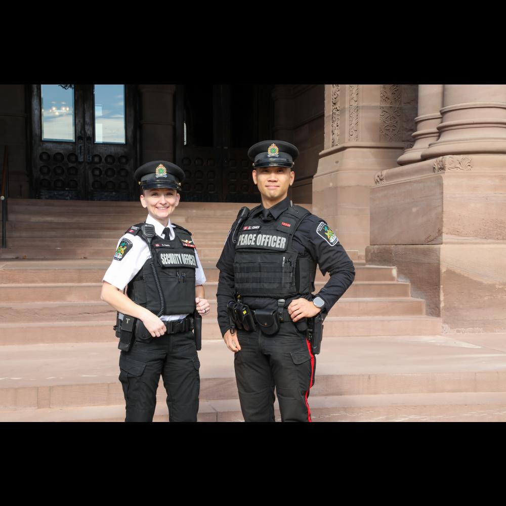 Peace Officer and Protective Service Officer in front of the Legislature