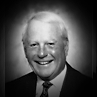 A headshot of Allan F. Leach