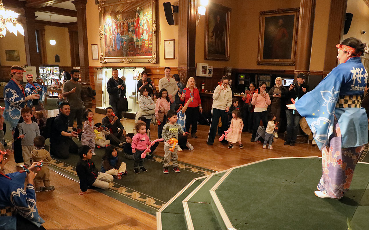 performer in front of audience inside Legislative Building