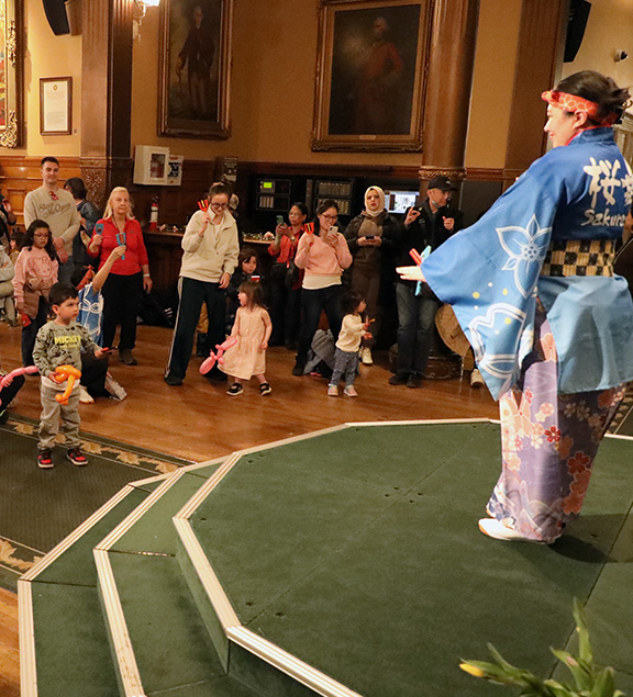 performer in front of audience inside Legislative Building