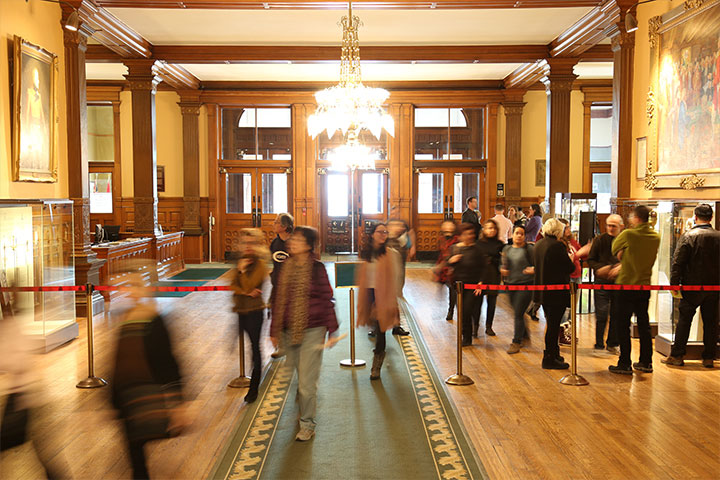 people standing in the lobby of the main building