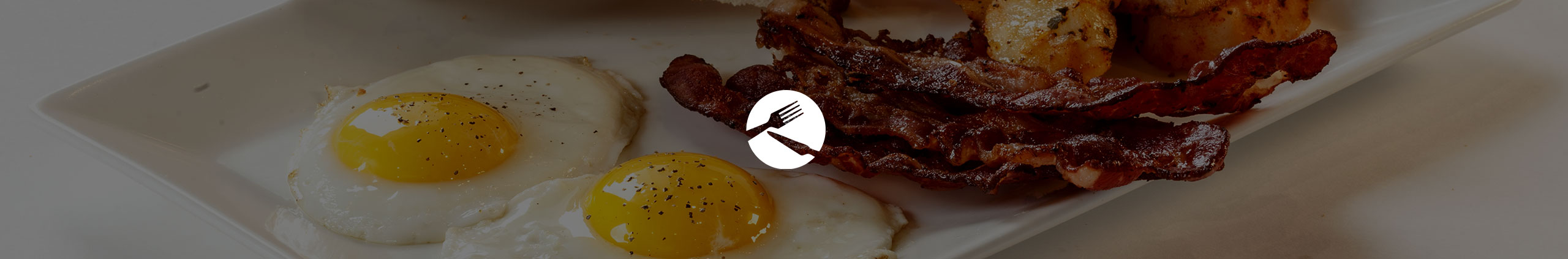 two eggs sunny side up with bacon