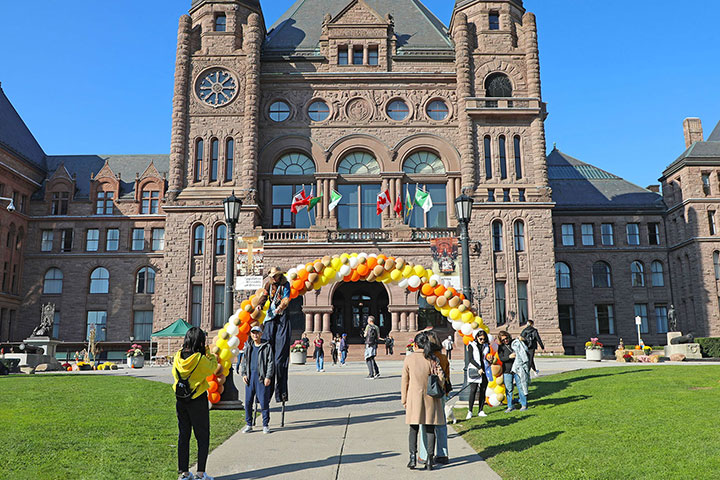 people at the fall festival in front of the Legislative Building