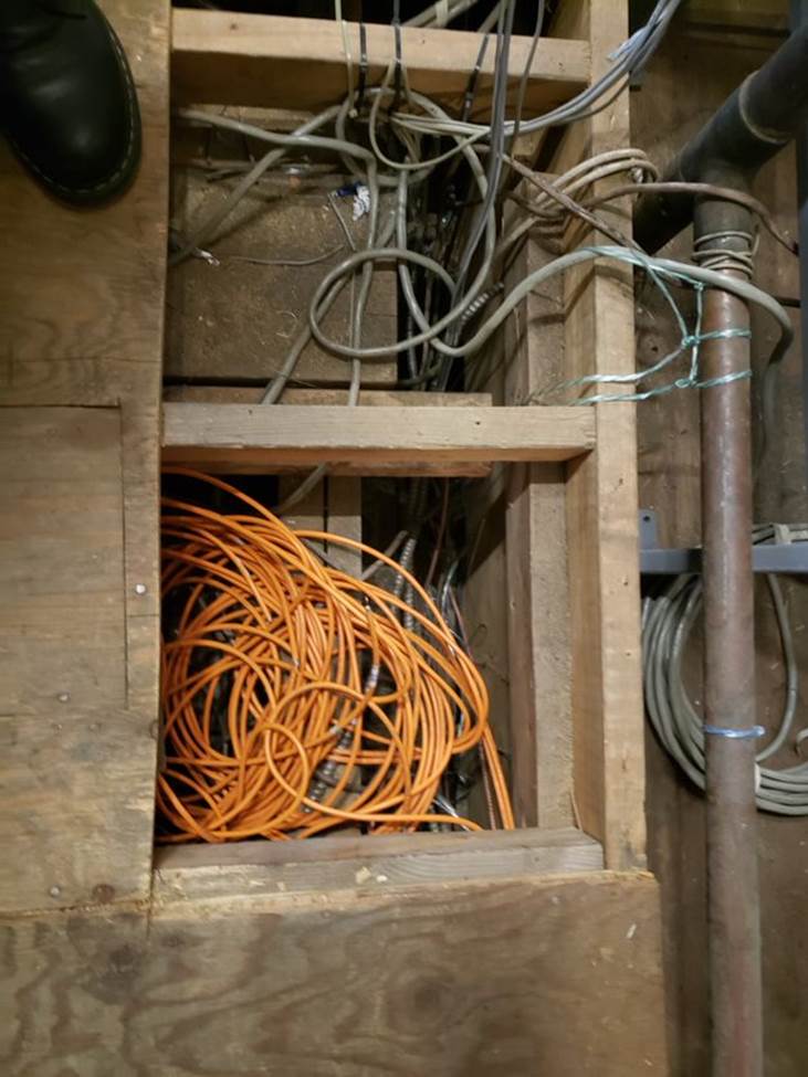 Picture of cables running in vertical vent shafts.