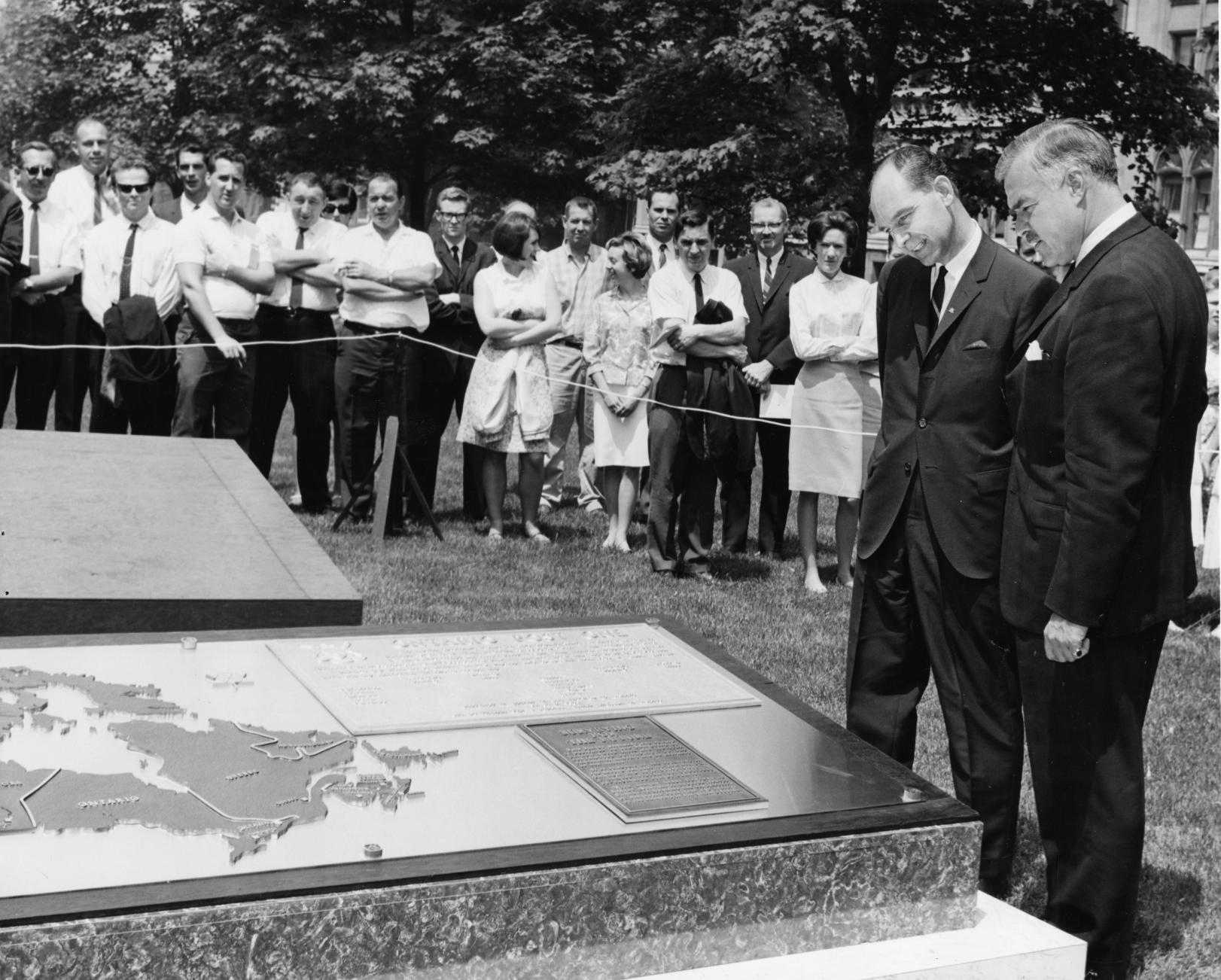 Premier Robarts unveils the Post One monument to commemorate Canada’s centennial in 1967, on the east side of the Legislative grounds. 