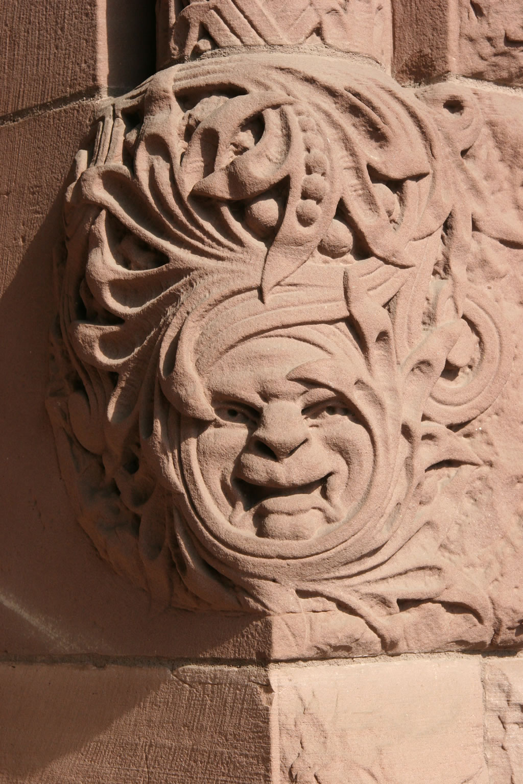 Face carved into the sandstone by the south entrance of the Legislative Building.