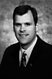 A headshot of John Baird