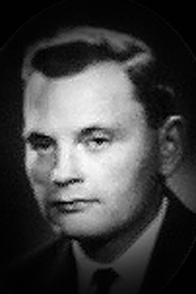 A headshot of Louis M. Hodgson.