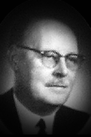 A headshot of Norman Davison.