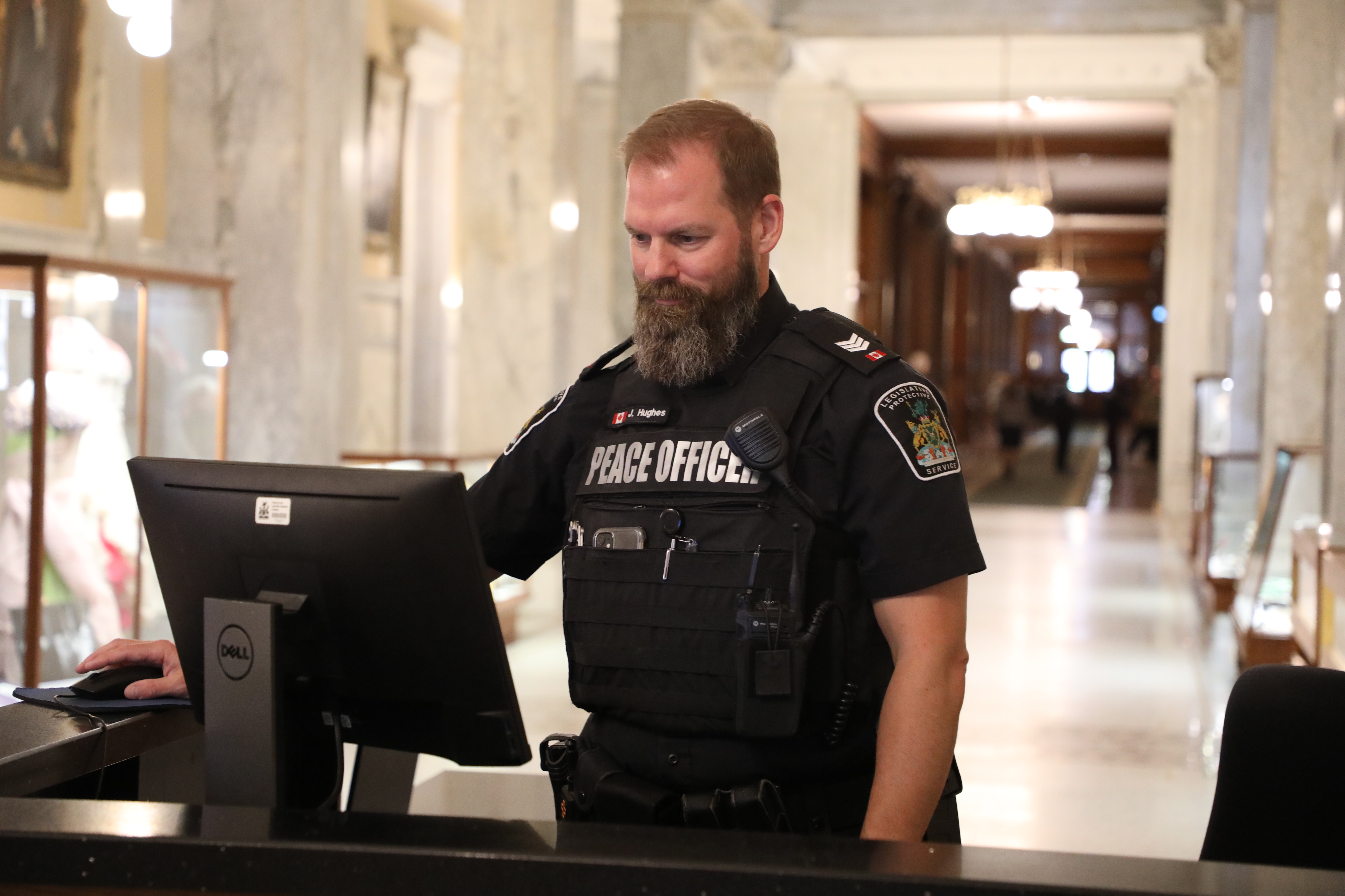 Peace Officer at a security desk