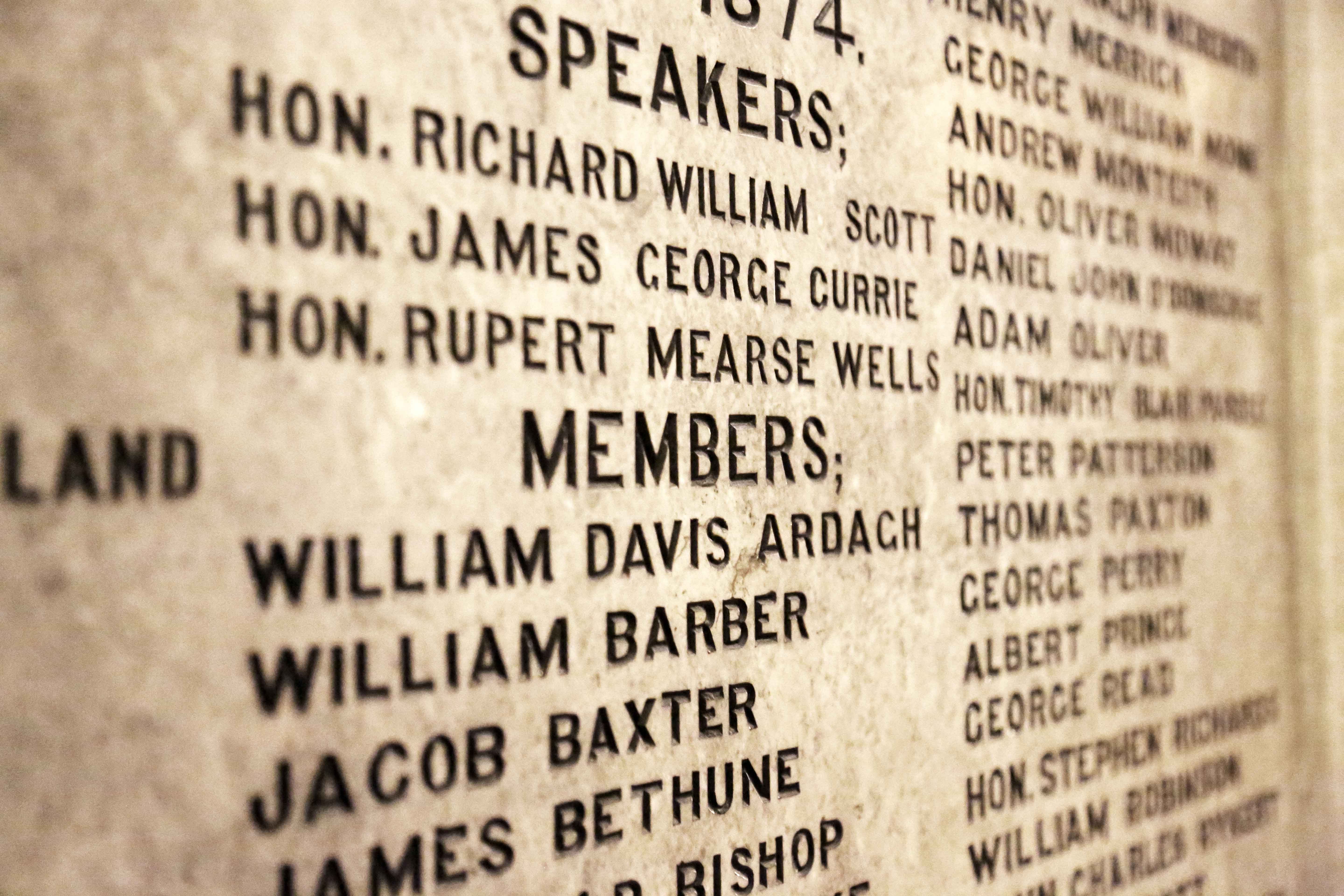 Carved names of MPPs on a marble wall