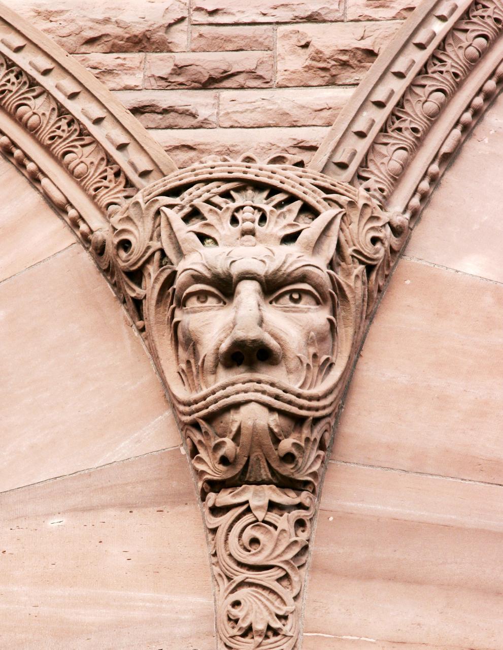 Picture of a sandstone carving on the exterior of the Legislative Building