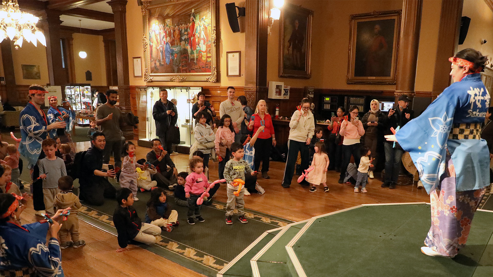 performer in front of audience inside Legislative Building