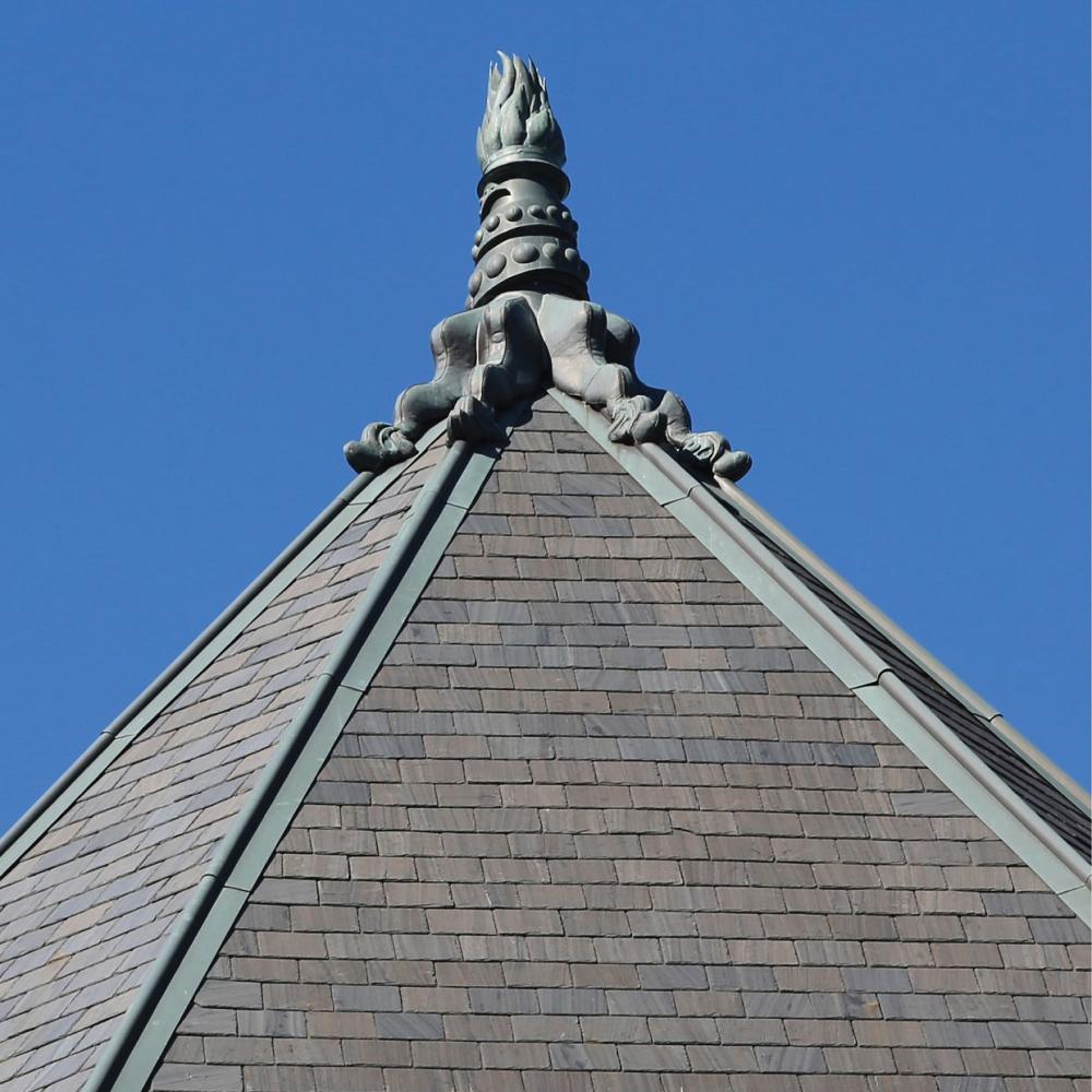 Close-up of a copper finial on the slate roof of the Legislative building.