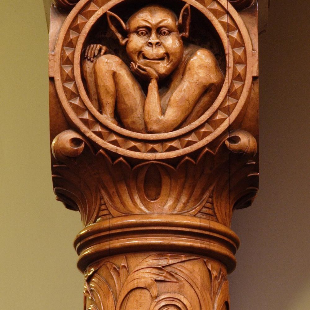 Picture of a wood carving of a gargoyle in the Legislative Chamber.