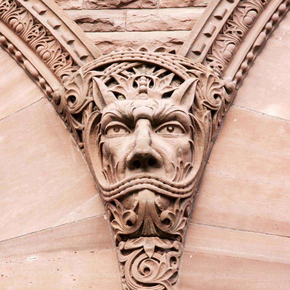 Picture of a sandstone carving on the exterior of the Legislative Building