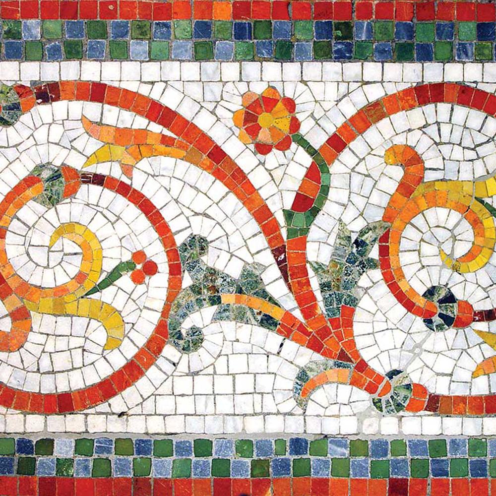 ornate mosaic pattern of red, orange, and yellow marble against a white background